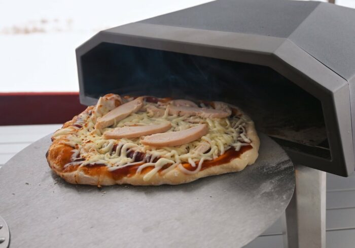 turning a pizza being cooked in a vevor gas pizza oven