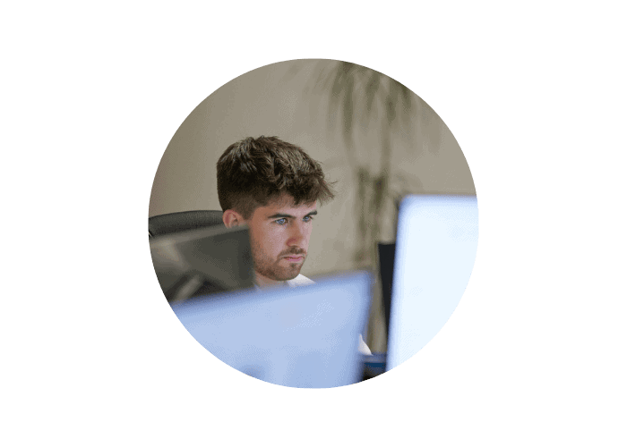 Harry working at screens