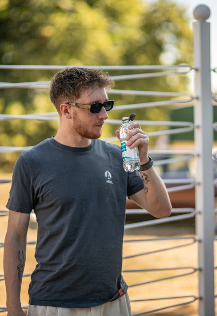 Man drinking bottle of South Downs Water at Goodwood's Festival of Speed