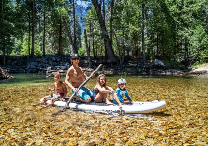 large inflatable paddleboard on a lake