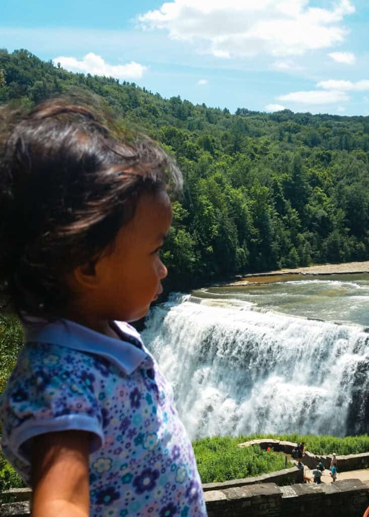 child enjoying views of Middle Falls in Letwchworth park