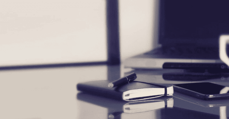 notebook filled with reasons to hire a marketing agency