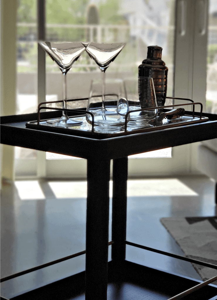 Bar cart with martini glasses and shaker readied to roll out onto the garden terrace for Mountain Shadows Resort Scottsdale Hotel Review