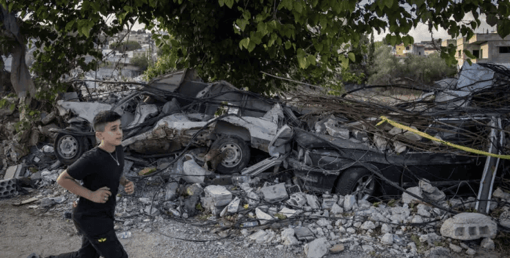 A boy runs past cars destroyed in a recent Israeli strike on August 24, 2024 Mays Al-Jabal, Lebanon.
Chris Mcgrath | Getty Images News | Getty Images
