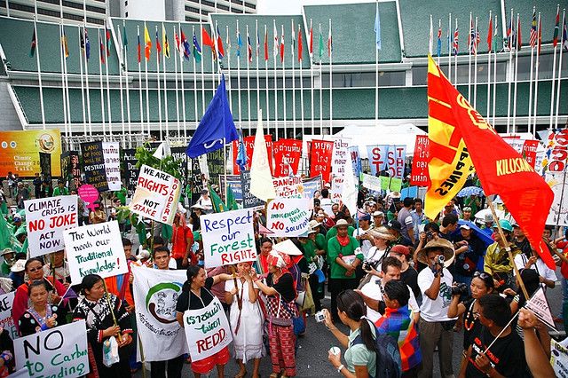 Picture: Oxfam International - Civil societies and grassroot communities protest in front of the UN conference center demanding rich nations to step up efforts to reduce greenhouse gas emissions in 2009. Sourced from Flickr and reproduced under a Creative Commons Attribution-NonCommercial-NoDerivs 2.0 Generic (CC BY-NC-ND 2.0) Licence