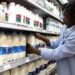 A consumer shops for milk products in a Nairobi supermarket. Simon Maina/ AFP via. Getty Images