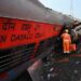 A rescue worker looks into a damaged carriage at the accident site of a three-train collision in Balasore district in the eastern Indian state of Odishaut. (AFP)