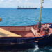 Grain is loaded aboard a cargo ship at the Azov Sea Port, Rostov region, on July 22, 2023. (AFP)