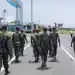 Soldiers of the Congolese Republican Guard walk on the tarmac of the airport in Goma,