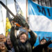 BUENOS AIRES, ARGENTINA - SEPTEMBER 25: Presidential candidate Javier Milei of La Libertad Avanza lifts a chainsaw next to Buenos Aires province governor candidate Carolina Piparo of La Libertad Avanza during a rally on September 25, 2023 in San Martin, Buenos Aires, Argentina. (Photo by Tomas Cuesta/Getty Images)