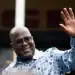 DR Congo President Felix Tshisekedi waves to his supporters after casting his ballot inside a polling station in Kinshasa [File: Mosa'ab Elshamy/AP]