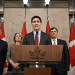 Prime Minister Justin Trudeau addresses the media following the imposition of a raft of tariffs by U.S. President Donald Trump against Canada, Mexico and China, in Ottawa on Saturday. Public Safety Minister David McGuinty, left to right, Foreign Affairs Minister Mélanie Joly and Finance Minister Dominic LeBlanc look on. (Justin Tang/The Canadian Press)