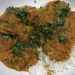 plate with rice and butter curry chicken