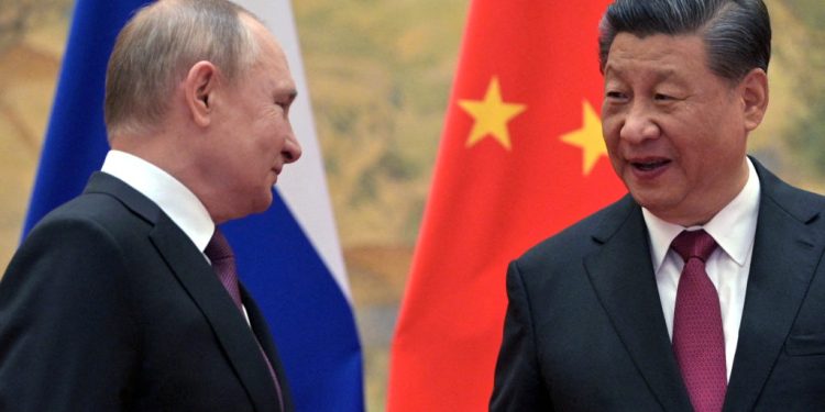 FILE PHOTO: Russian President Vladimir Putin attends a meeting with Chinese President Xi Jinping in Beijing, China February 4, 2022. Sputnik/Aleksey Druzhinin/Kremlin via REUTERS/File Photo ATTENTION EDITORS - THIS IMAGE WAS PROVIDED BY A THIRD PARTY.