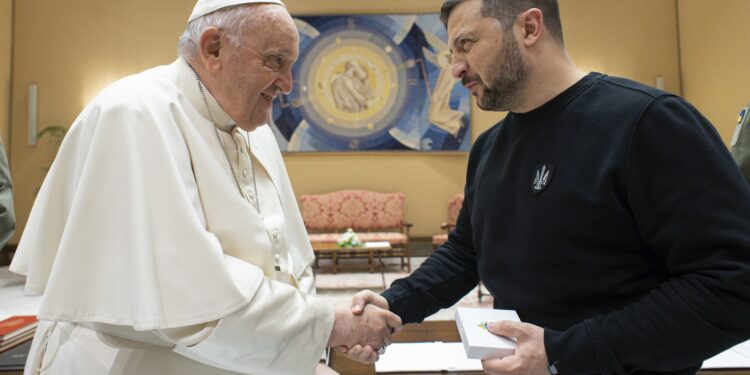 Pope Francis and Ukrainian President Volodymyr Zelenskyy shake hands after their meeting at the Vatican May 13, 2023. (CNS photo/Vatican Media)