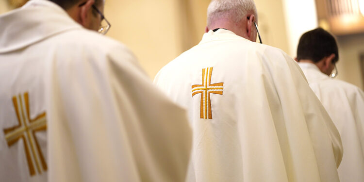 Priests are seen during a special Mass for vocations at Cure of Ars Church in Merrick, N.Y., Aug. 4, 2022, the feast of St. John Vianney, patron of parish priests. (CNS photo/Gregory A. Shemitz)