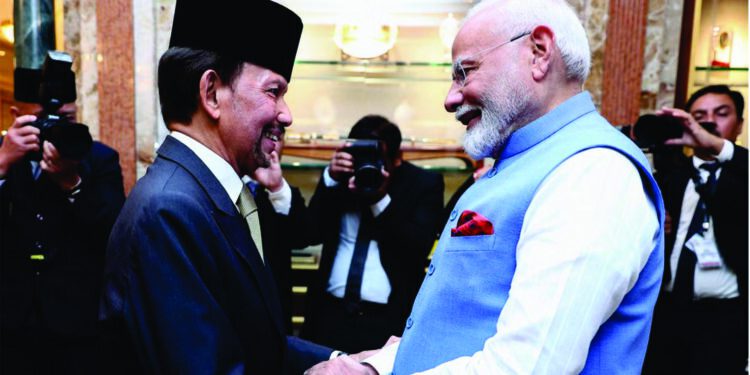 India’s prime minister Narendra Modi (R) shakes hands with Brunei Sultan Hassanal Bolkiah (L) prior to a meeting at Istana Nurul Iman in Bandar Seri Begawan on 4 September 2024 (AFP via Getty Images)