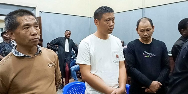 Cheng Chang-Fu, Wan Ling-Wu, and Cheng Hai-Yan, all Chinese citizens arrested in possession of gold bars and $400,000 in cash and found guilty of illegal activities linked to the artisanal mining sector, stand inside the courtroom in Bukavu, South Kivu Province of the Democratic Republic of the Congo January 14, 2025. REUTERS/Crispin Kyalangalilwa