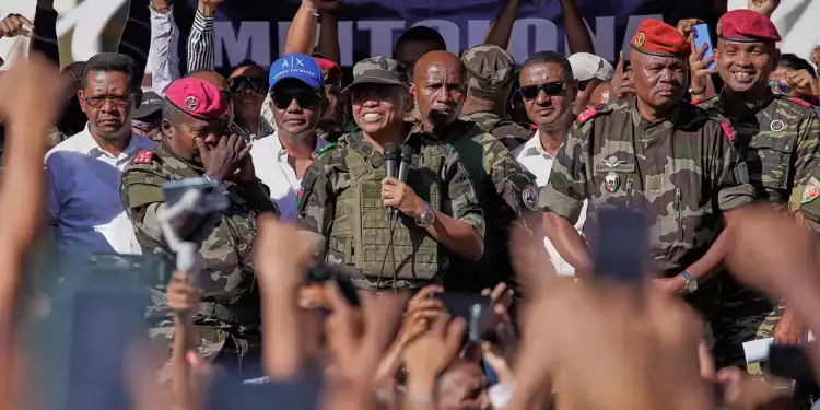 CAPSAT military unit commander Col. Michael Randrianirina announces to protesters that the armed forces are taking control of the country in Antananarivo, Madagascar, Tuesday.   -  Copyright © africanews
Copyright 2025 The Associated Press. All rights reserved