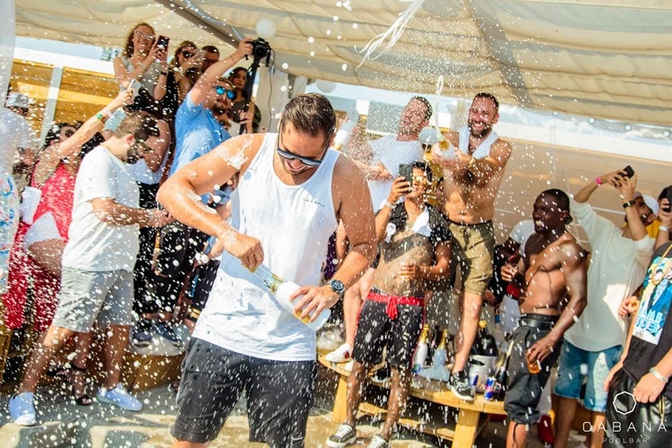 Rick Ross' BELAIRE Champagne gets sprayed in a private Cabana all over a guy