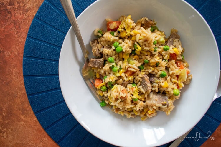 served portion of beef fried rice in bowl.