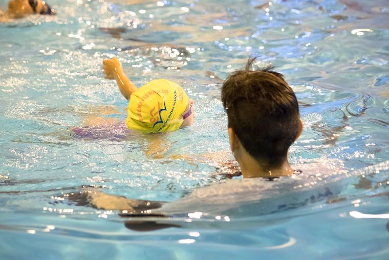 teaching swimming in water