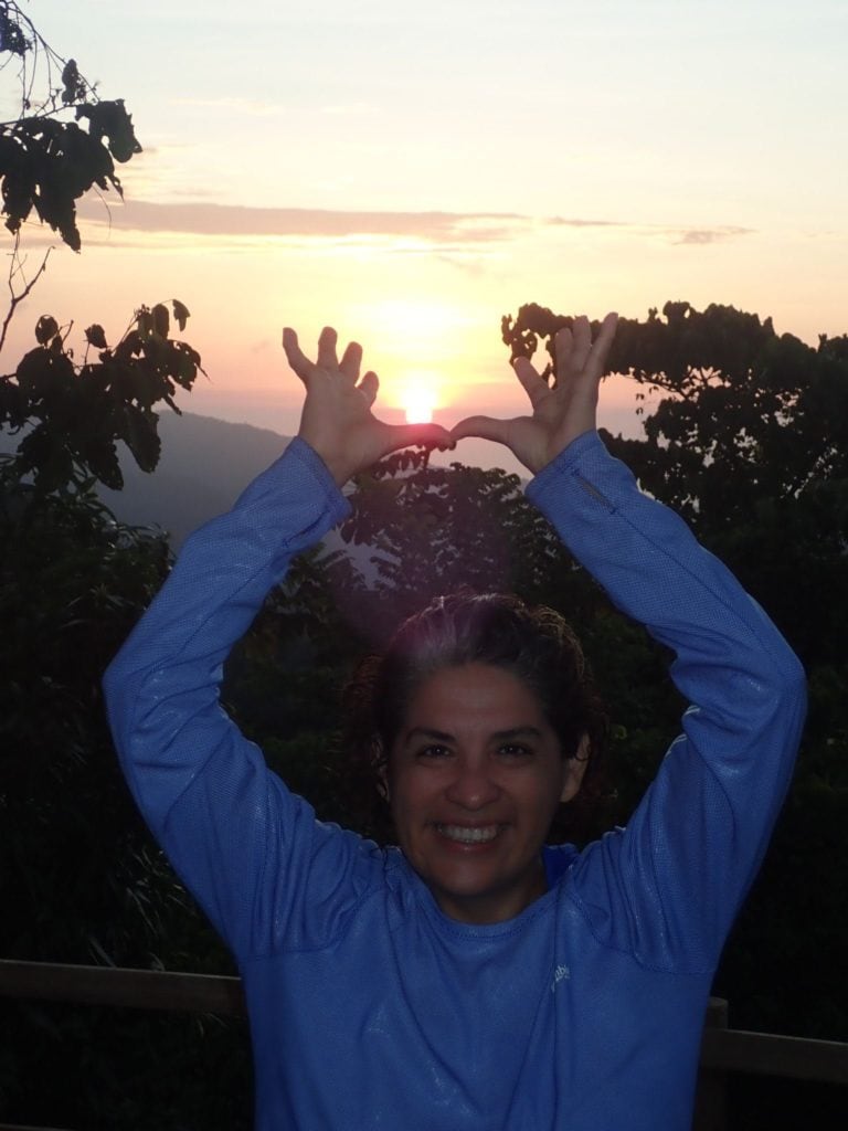 Charo holding the sun in Minca, Colombia