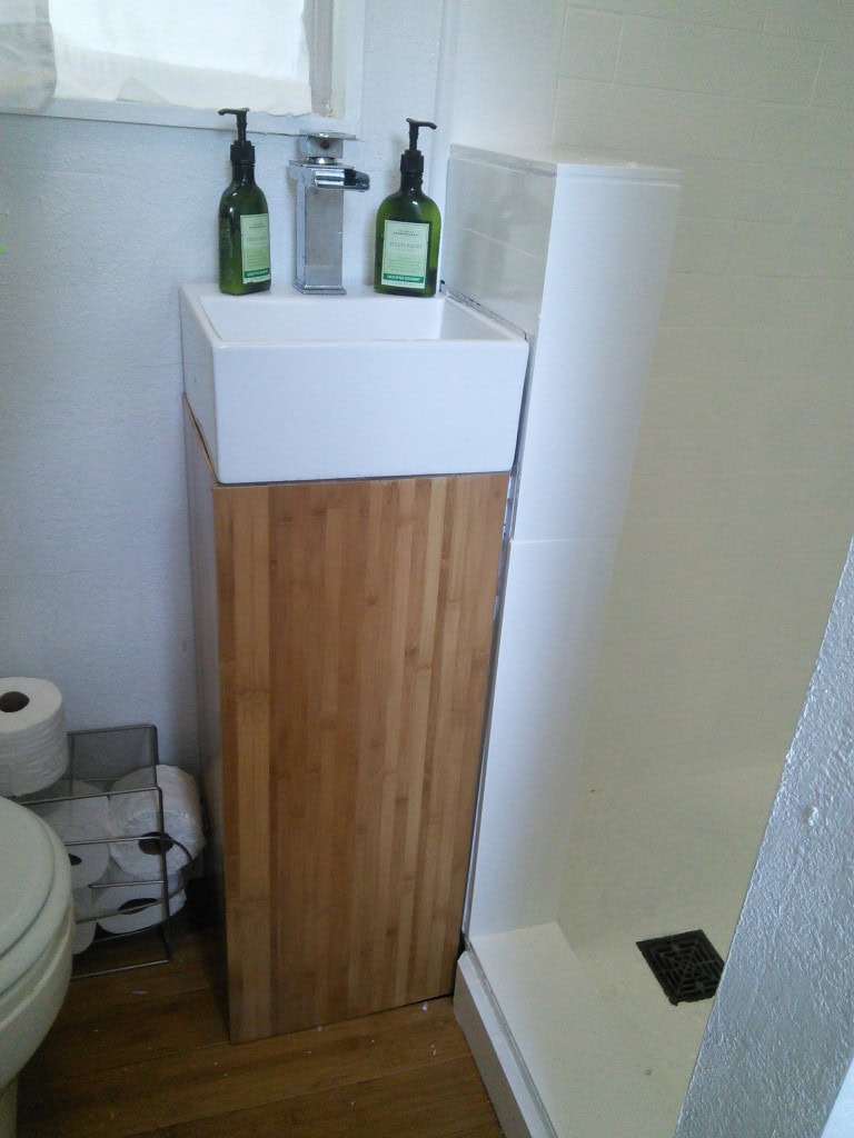 The new bathroom sink, this used to be the dark birch wood, swapped out for bamboo