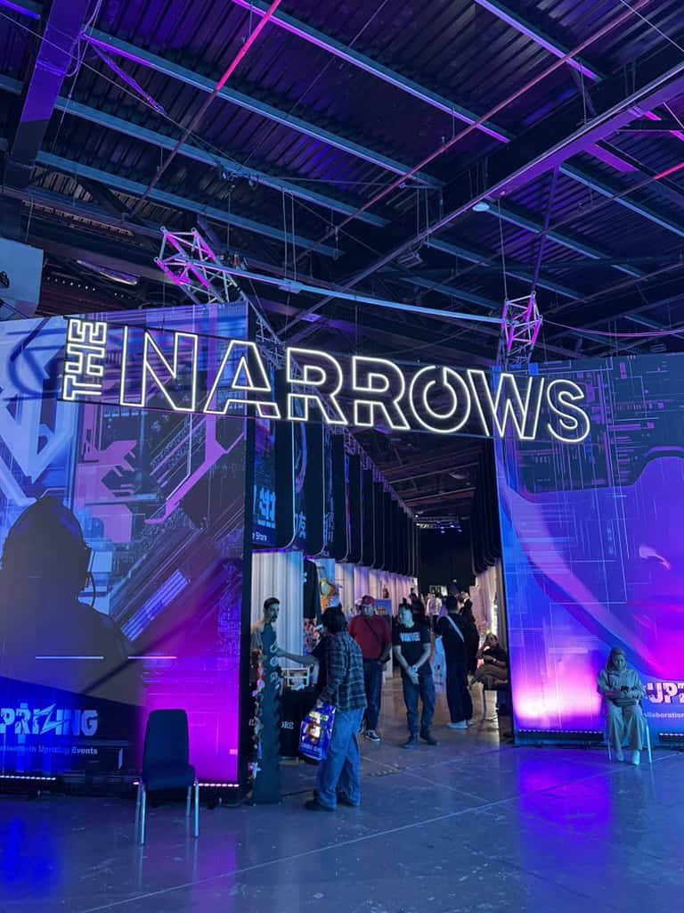 Neon lighting display with vibrant purple and blue hues at T AV Showcase event.
