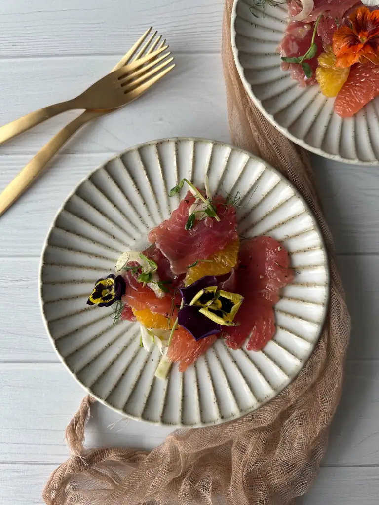 Plate of crudo on rimmed plate