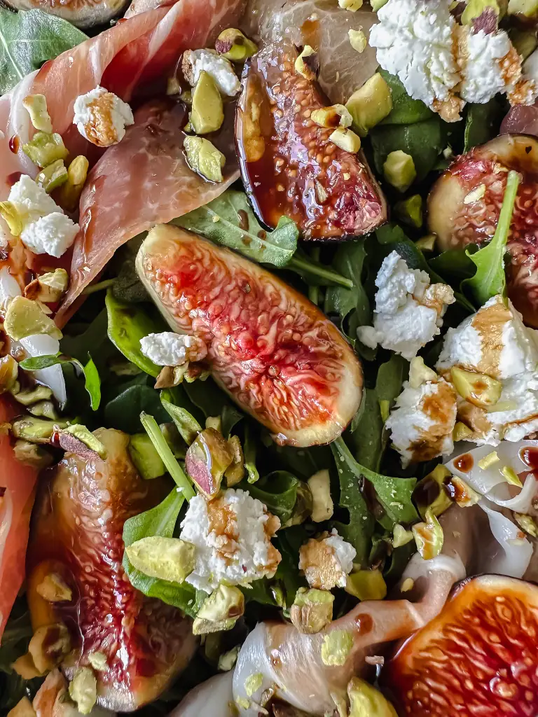 Close up macro of fig and prosciutto salad