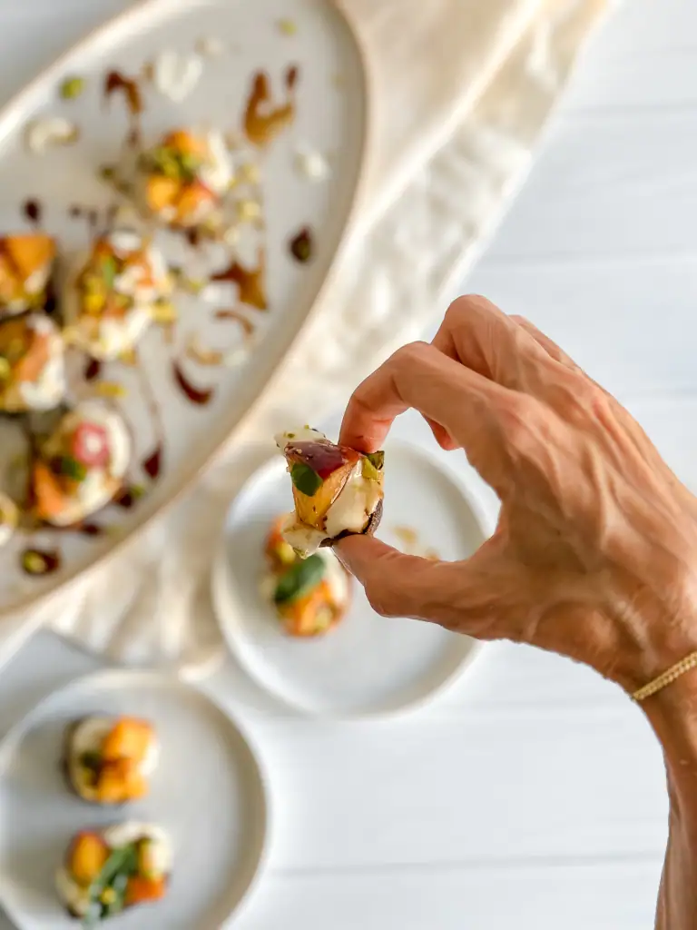 Hand with bruschetta in hand