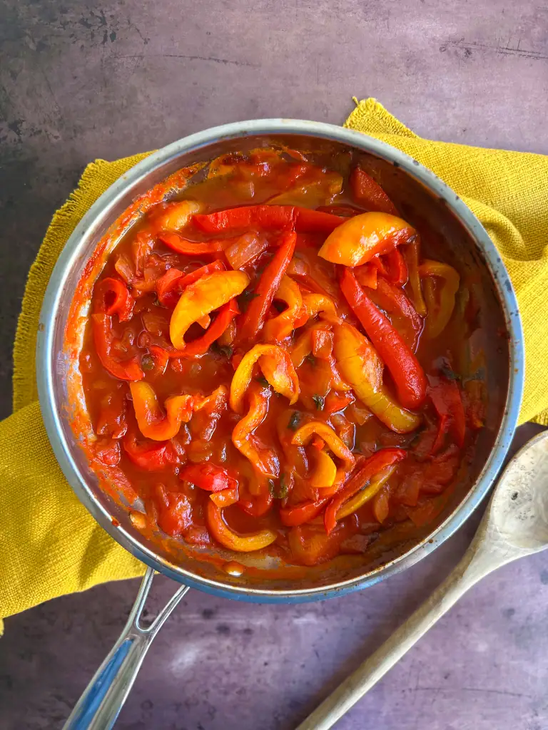 peperonata in a pot over yellow napkin