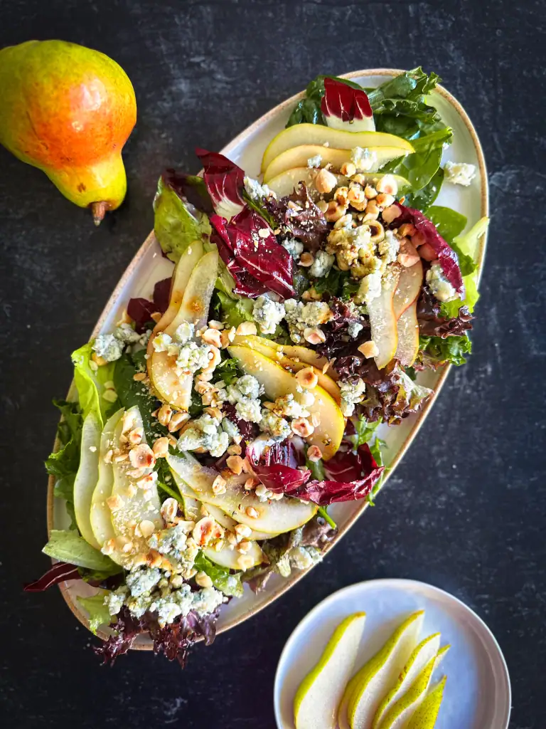Pear Gorgonzola Salad on a serving oval plate