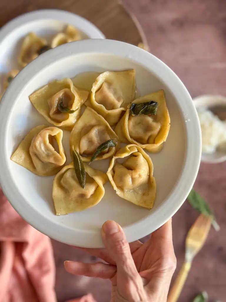 Hand of Pumpkin Tortelli in hand