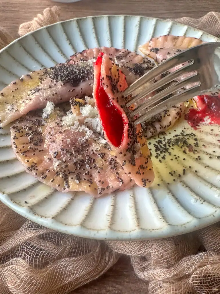 close up of casunzei, revealing the filling