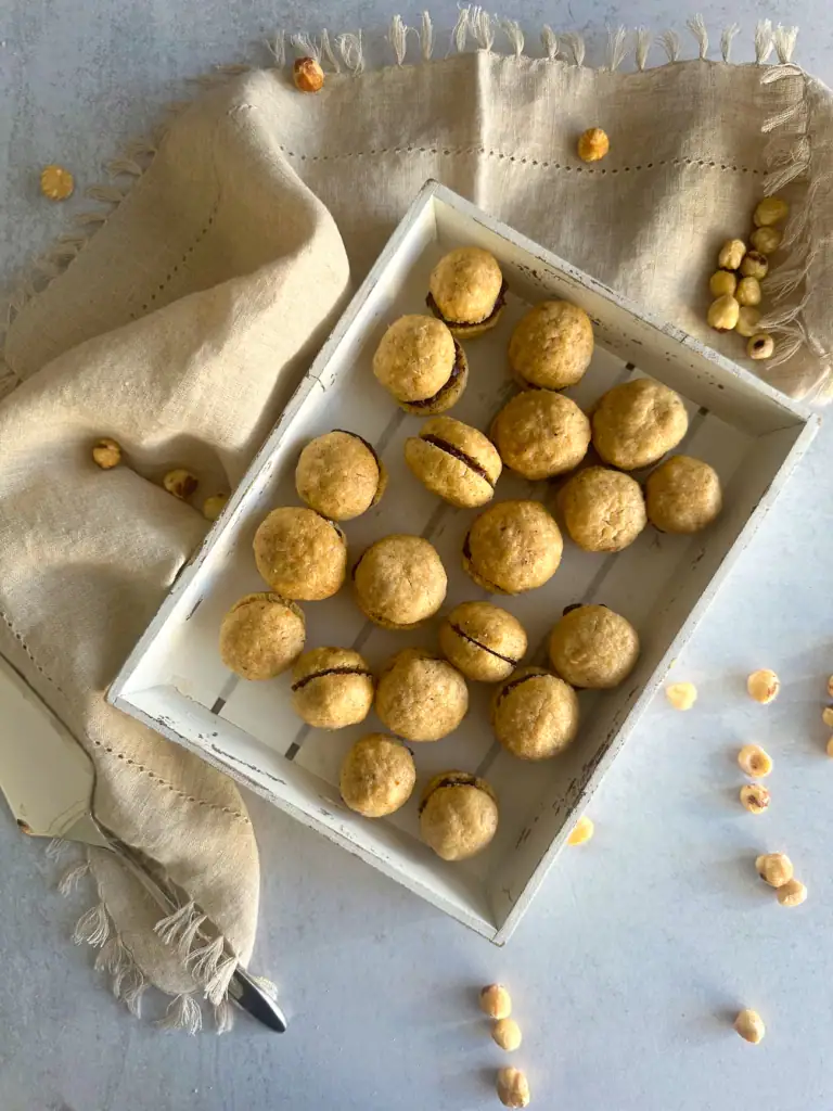 Baci di dama in a white tray