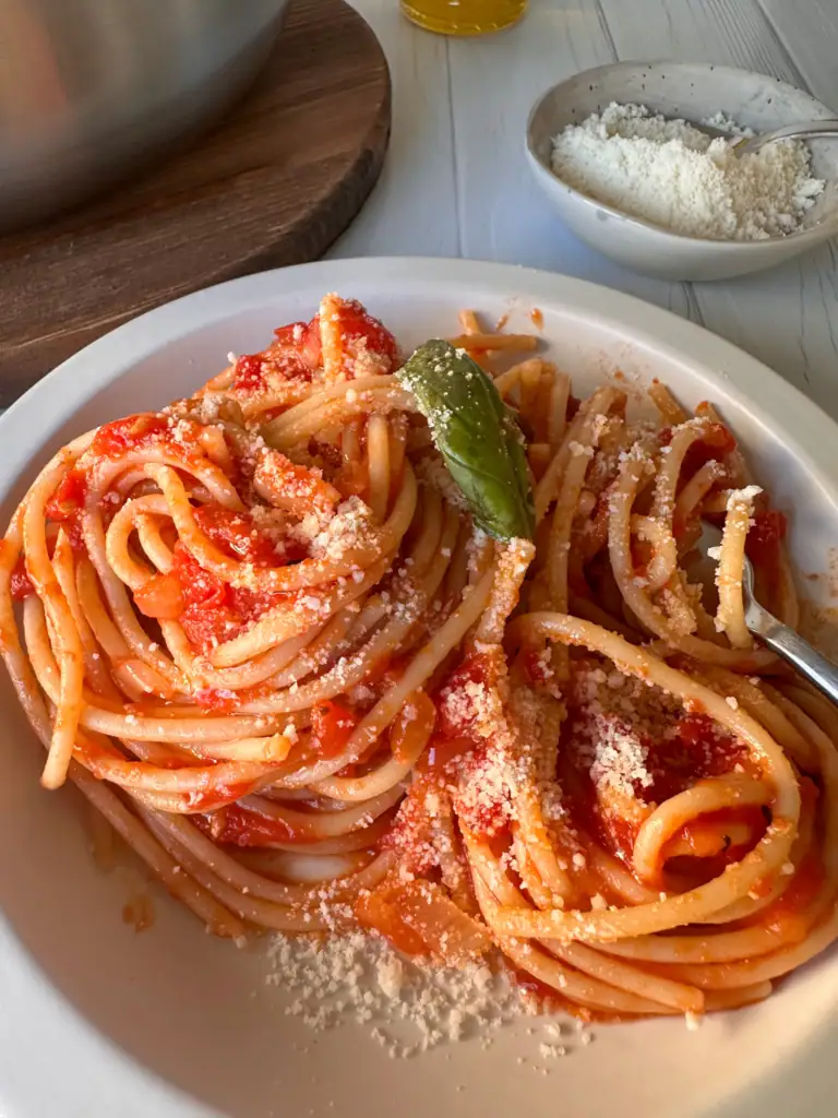 Spaghetti with Italian tomato sauce sprinkled with Parmesan
