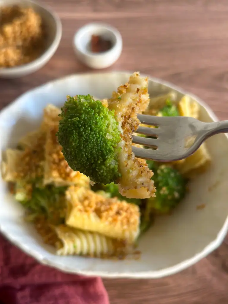 Rigatoni with Broccoli Anchovies Crispy Breadcrumbs on a fork by side