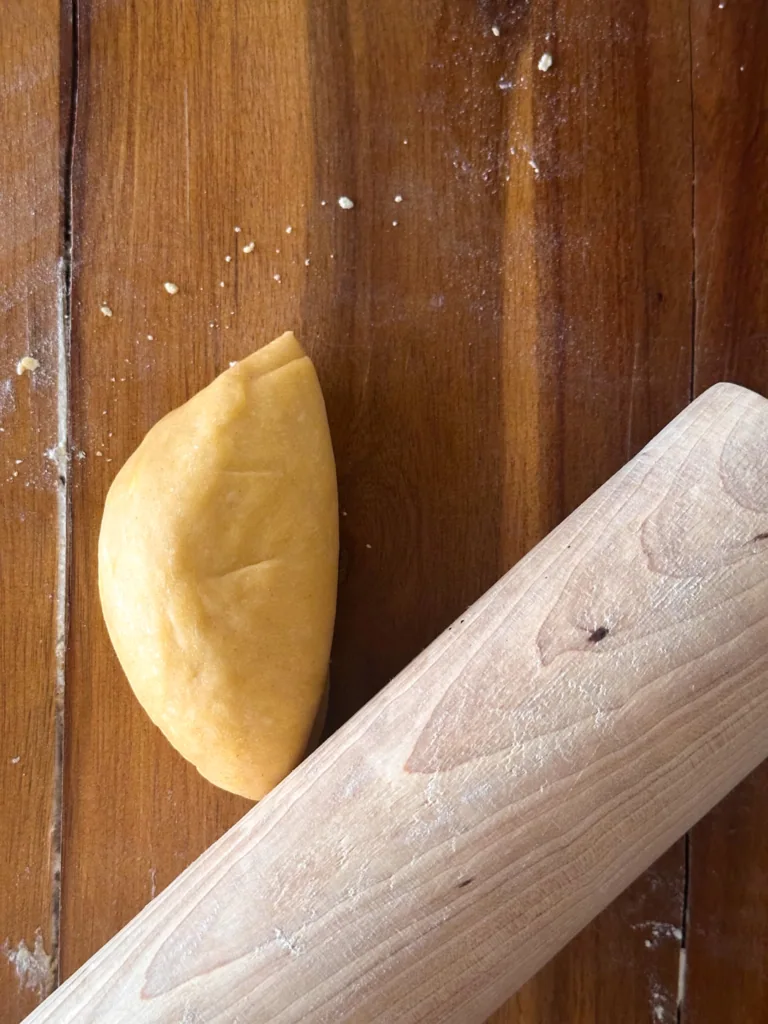 dough ready to be rolled first with a rolling pin