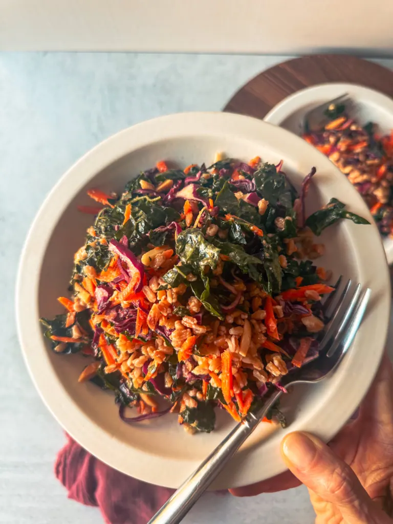 Kale salad with farro in hand