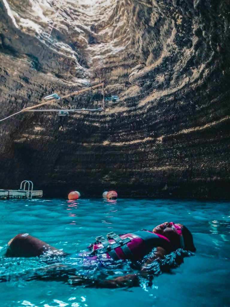 girl swimming inside Homestead Crater
