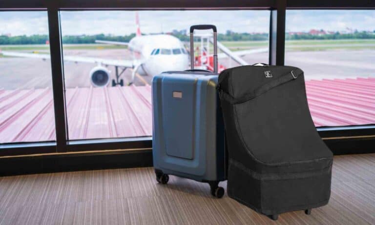 car seat travel bag and suitcase at the airport