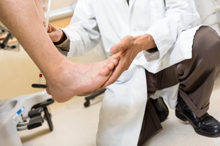 Podiatrist examining a patient's foot