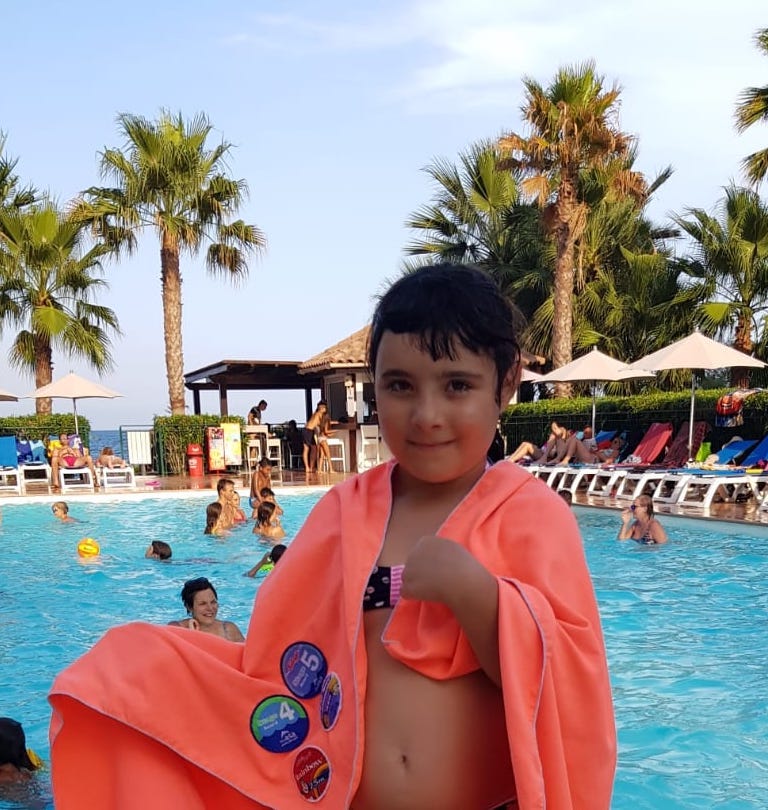 swimming badges swing on towels