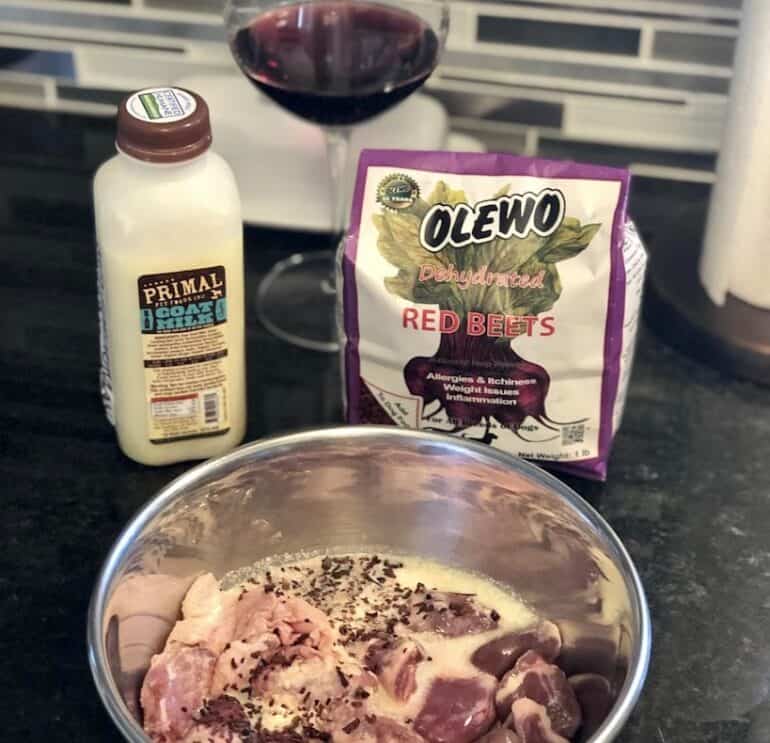 Adding goats milk to raw dog food - the wine is mine!