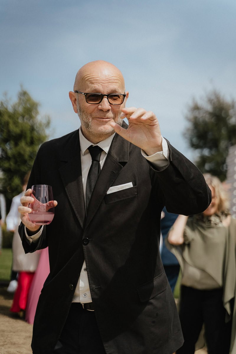 Wedding guest looking towards camera