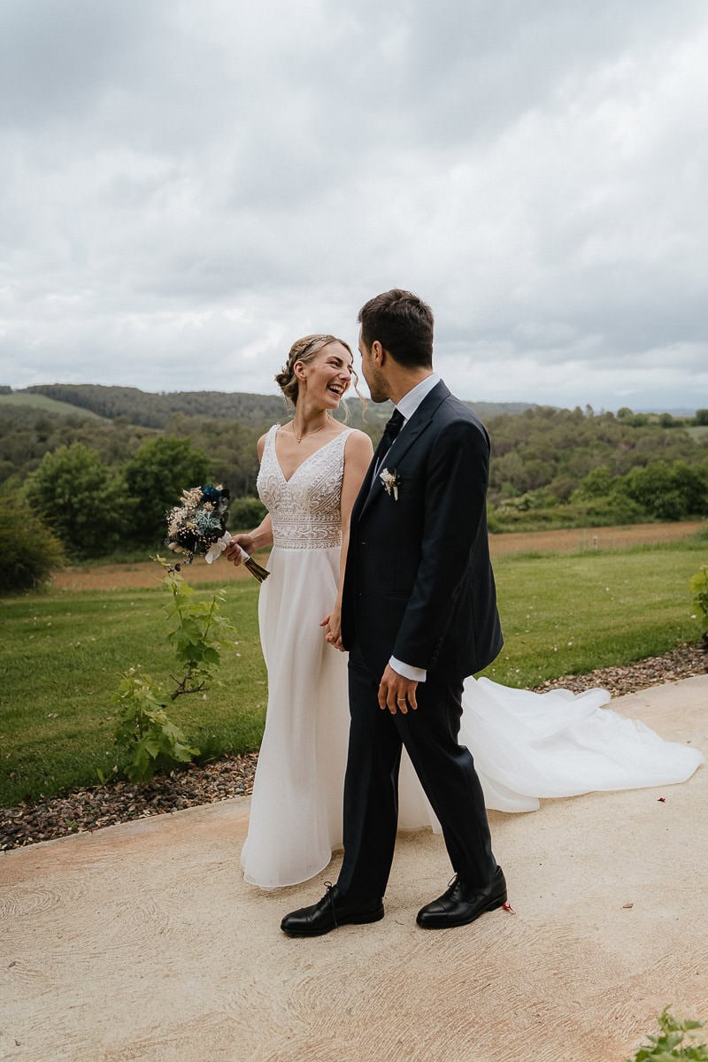 Bride and groom walking at path at finca wedding venue in Girona