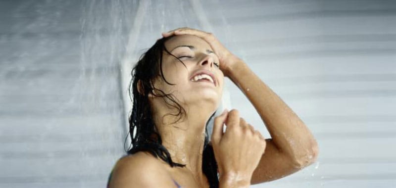 woman doesn't know if she should exercise before or after a bath or shower