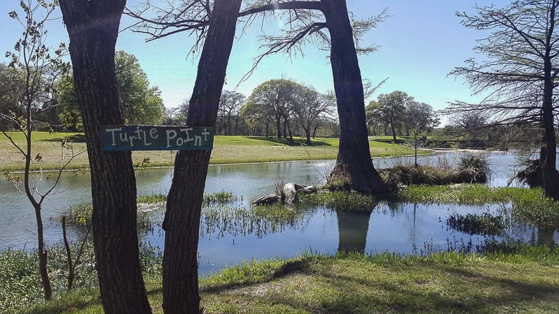 Sign that says 'Turtle Point' at by the river RV Park in texas that we sat by while learning to embrace slow travel